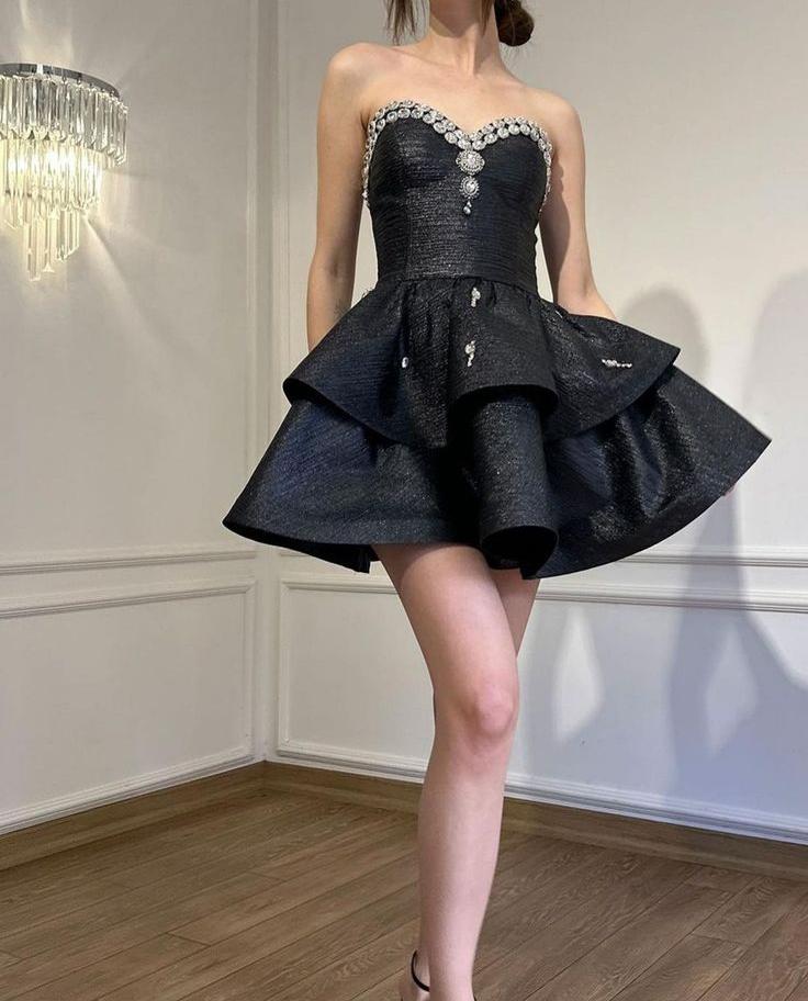 black dress with silver diamonds Dressed in black, powered by confidence. REUSE BLACK AND SILVER LONG SLEEVELESS GOWN WITH CRYSTALS AND CAPE